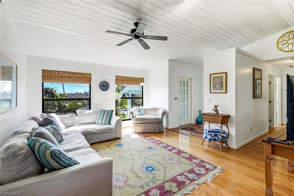 647 Rabbit Road Sanibel, FL 33957 - Photo 10 of 46 a living room with furniture and a large window