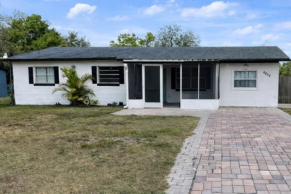 a front view of a house with a garden and porch