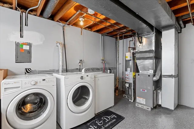 a view of a storage & utility room with washer and dryer