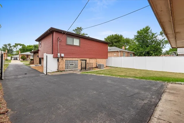 a view of a house with a street