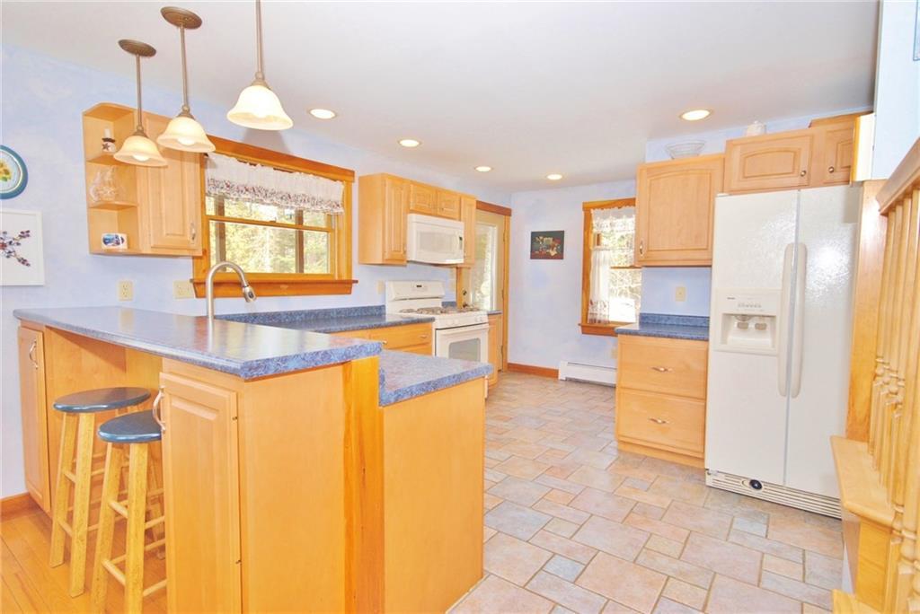 294 Pleasant River Road Milo, ME 04463 - Photo 4 of 33 Elevated bar in spacious, eat-in...