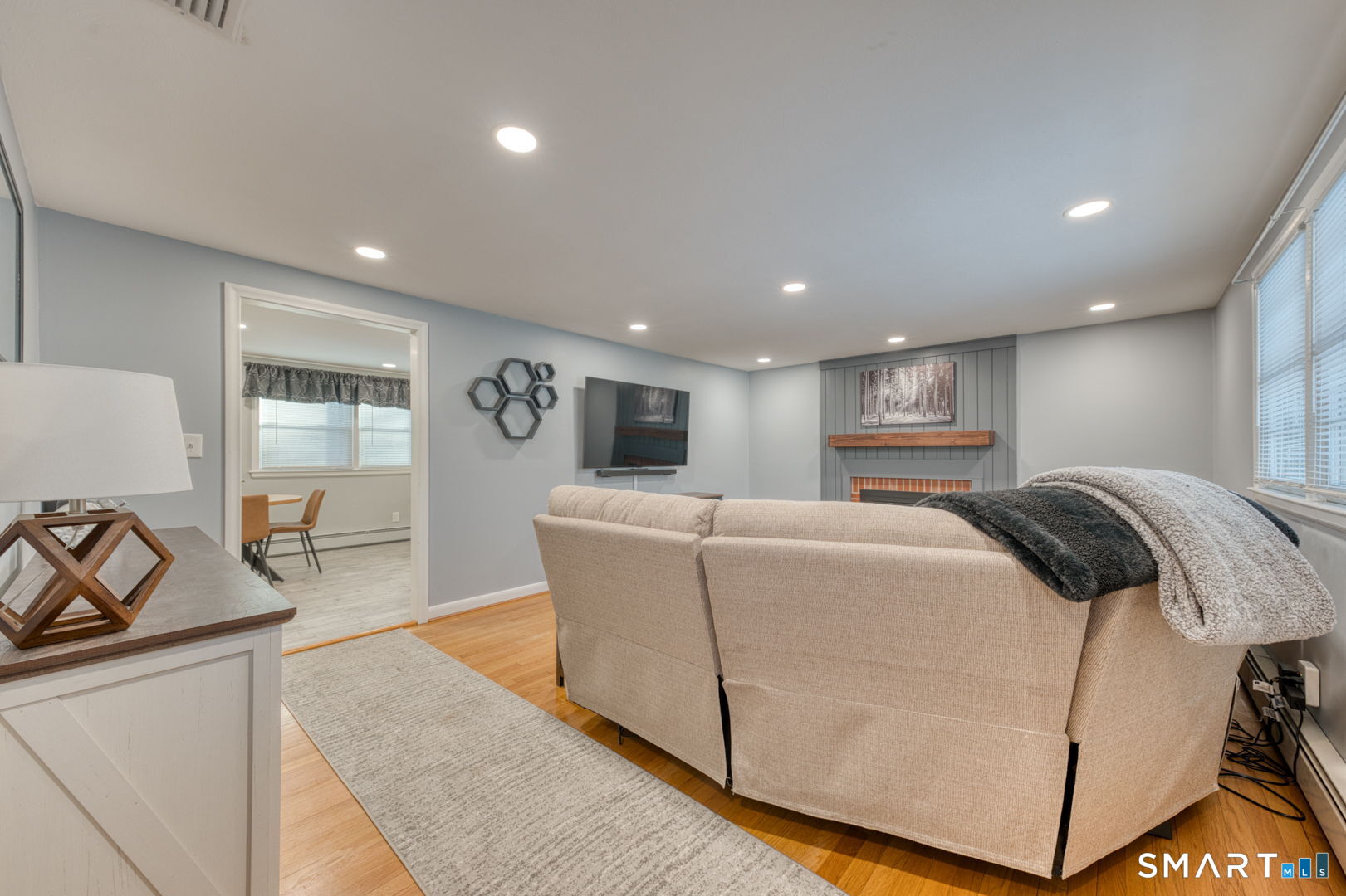42 Northbrick Lane Wethersfield, CT 06109 - Photo 13 of 37 a living room with furniture and a table