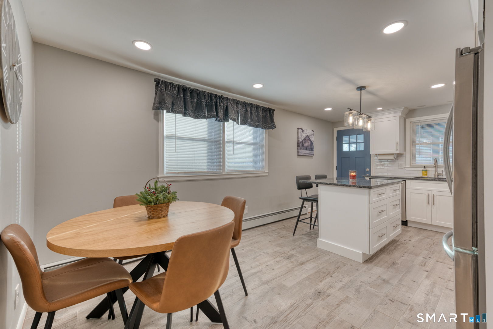 42 Northbrick Lane Wethersfield, CT 06109 - Photo 21 of 37 a kitchen with a table and chairs in it