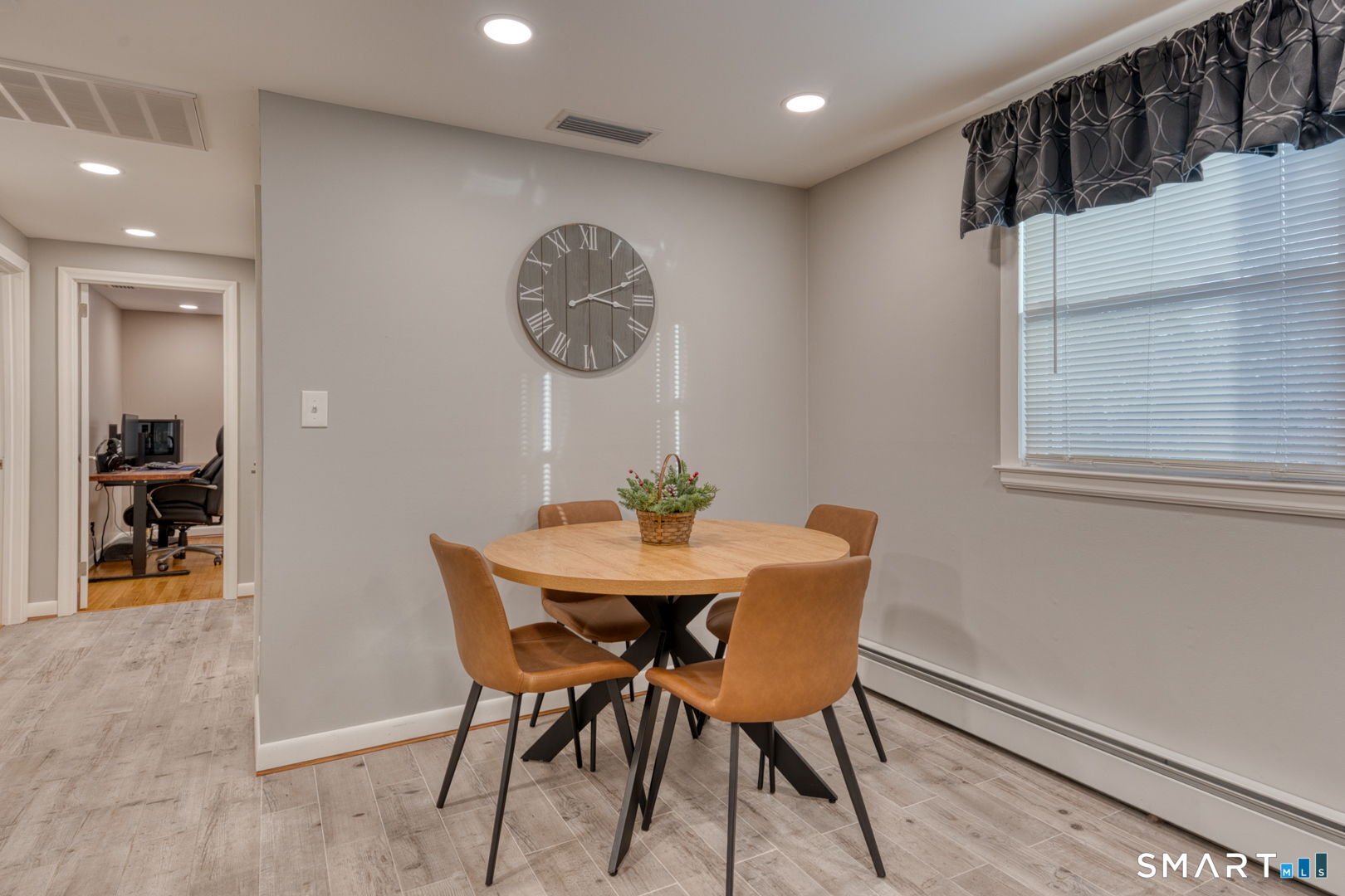 42 Northbrick Lane Wethersfield, CT 06109 - Photo 22 of 37 a view of a dining room with furniture and wooden floor