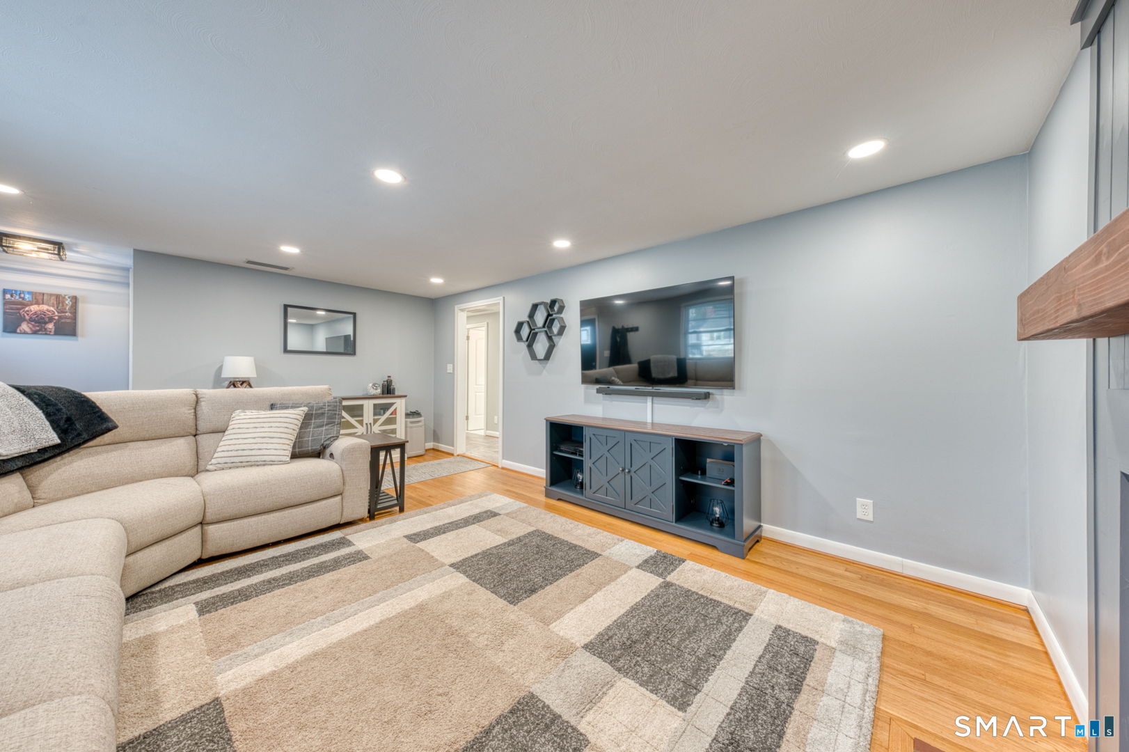 42 Northbrick Lane Wethersfield, CT 06109 - Photo 10 of 37 a living room with furniture and a flat screen tv