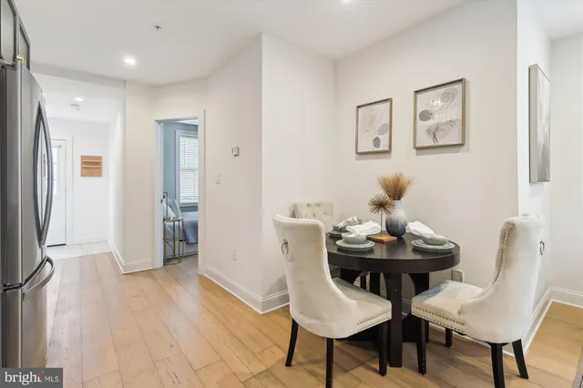 a view of a room with furniture and wooden floor