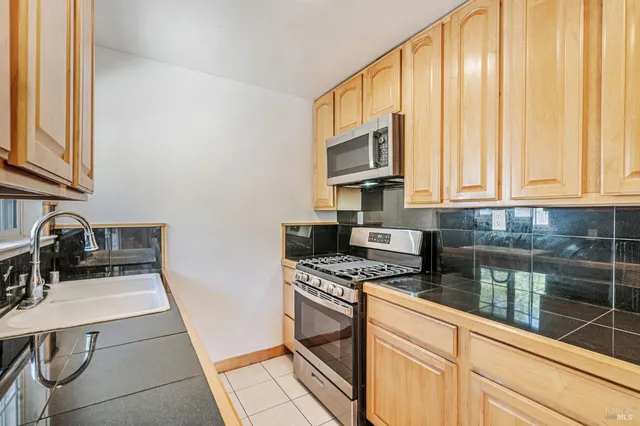 a bath tub sitting in a bathroom next to a window