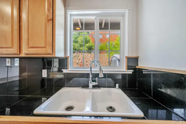 a kitchen with a stove and a microwave