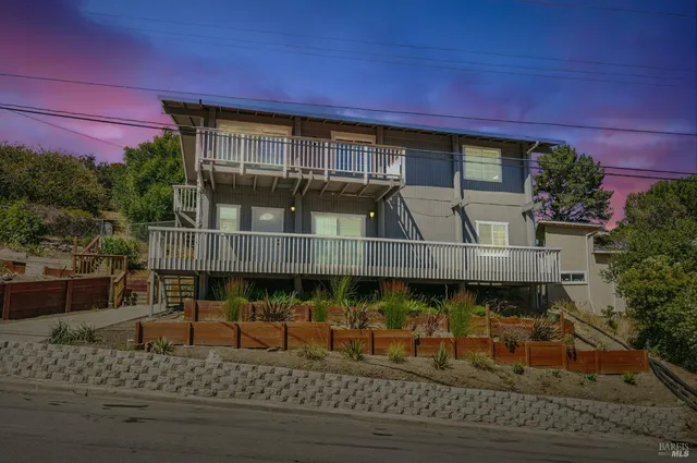 a front view of a house with a porch