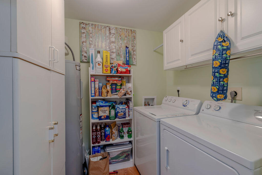 5520 East Harbor Village Drive, Unit 101 Vero Beach, FL 32967 - Photo 32 of 54 a utility room with dryer and washer