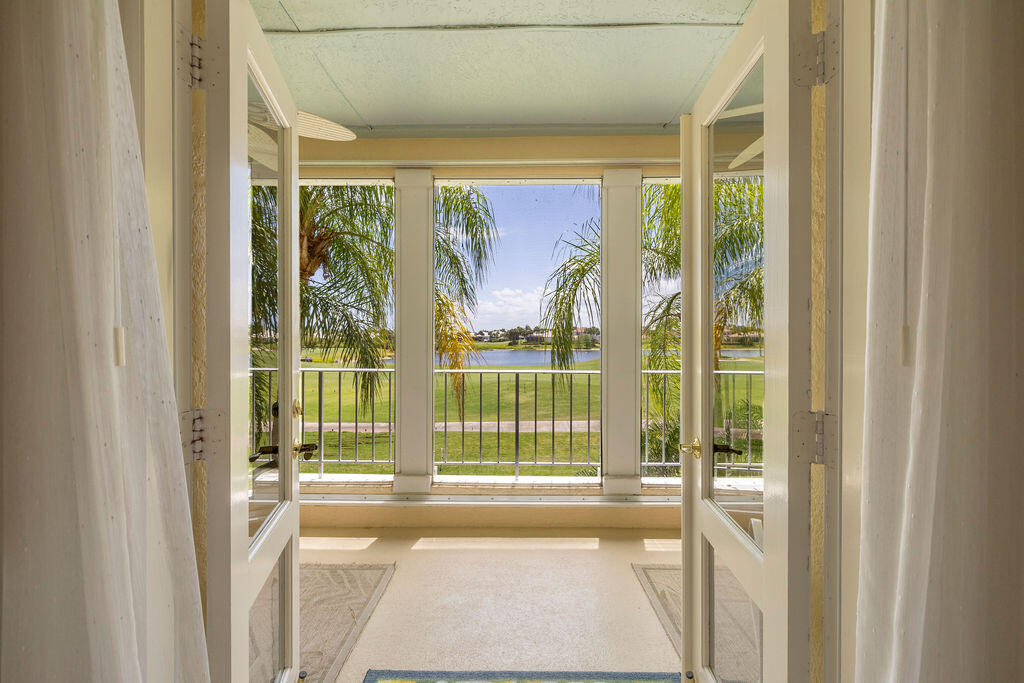 5520 East Harbor Village Drive, Unit 101 Vero Beach, FL 32967 - Photo 33 of 54 a view of a glass door with a glass door
