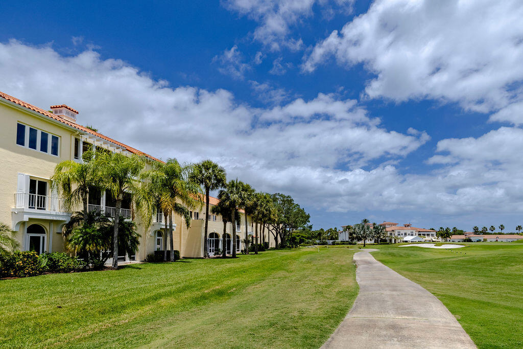 5520 East Harbor Village Drive, Unit 101 Vero Beach, FL 32967 - Photo 38 of 54 a view of a street with a building in the background