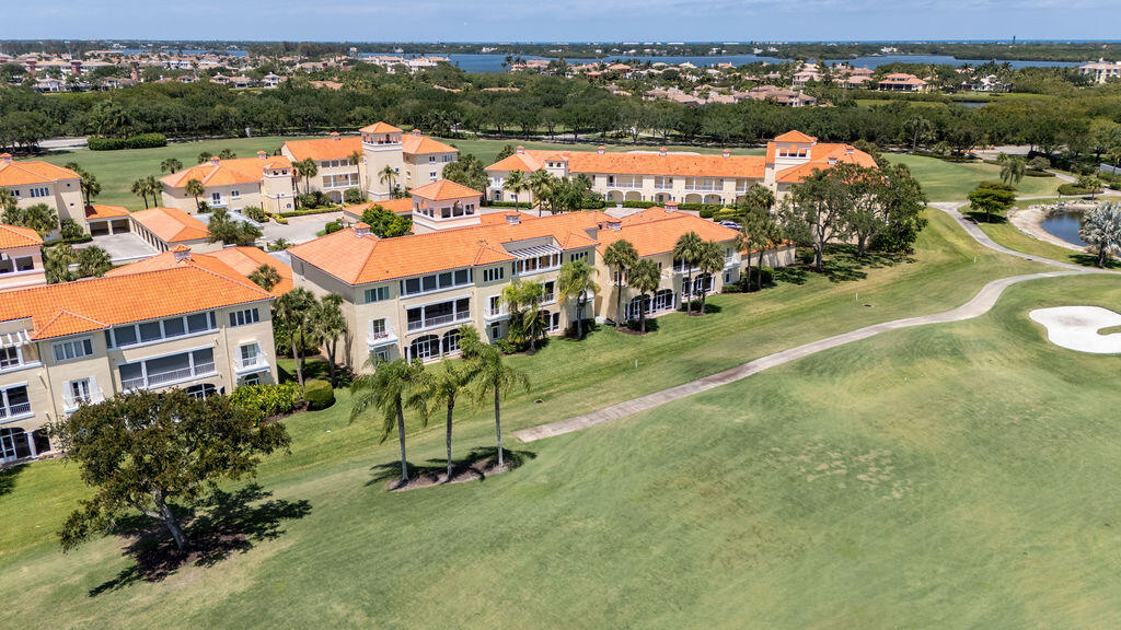 5520 East Harbor Village Drive, Unit 101 Vero Beach, FL 32967 - Photo 45 of 54 an aerial view of residential houses with outdoor space