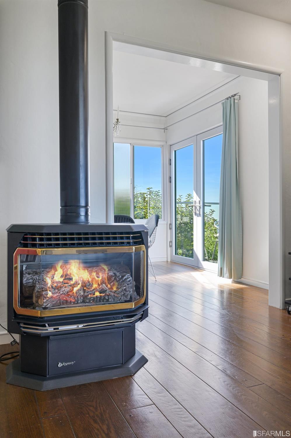 256 Columbia Avenue Kensington, CA 94708 - Photo 11 of 37 a room with furniture and a fireplace