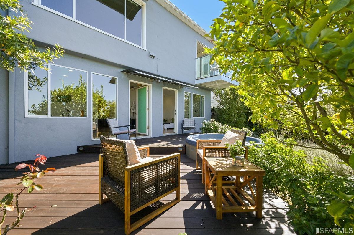 256 Columbia Avenue Kensington, CA 94708 - Photo 19 of 37 a view of a patio with couches table and chairs and potted plants