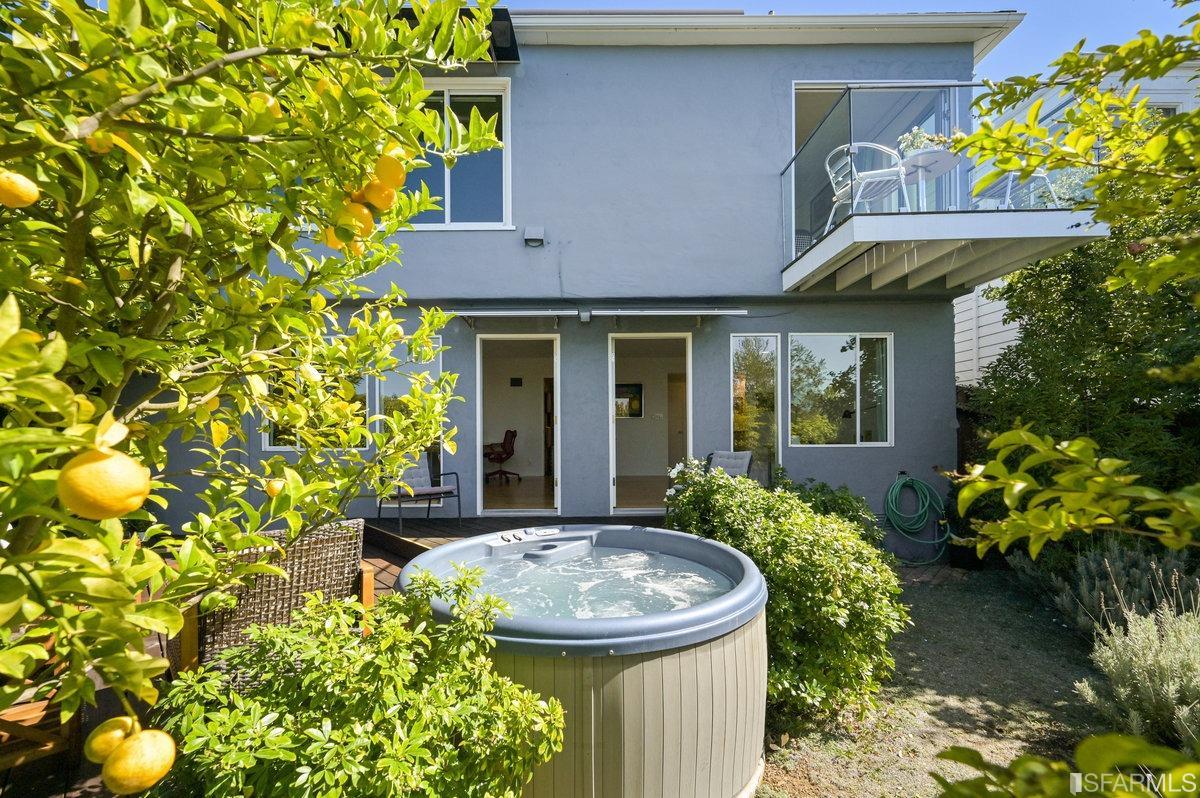 256 Columbia Avenue Kensington, CA 94708 - Photo 20 of 37 a view of brick house with a flower garden