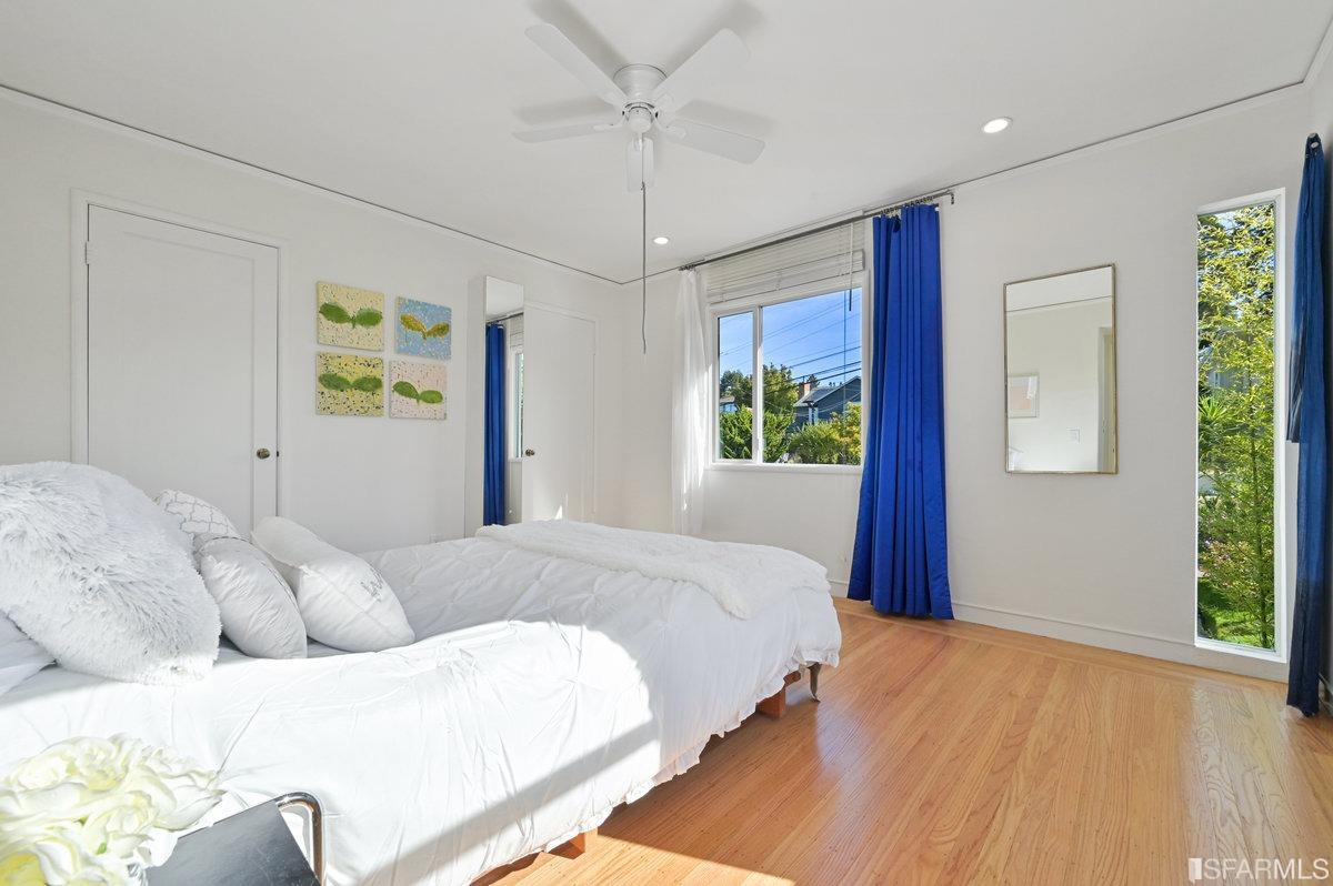 256 Columbia Avenue Kensington, CA 94708 - Photo 23 of 37 a bedroom with a large bed and a window