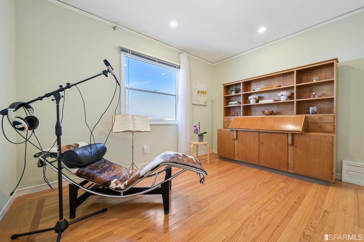 256 Columbia Avenue Kensington, CA 94708 - Photo 26 of 37 a room with furniture and wooden floor
