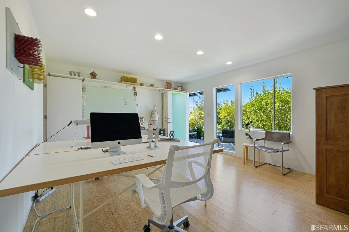 256 Columbia Avenue Kensington, CA 94708 - Photo 28 of 37 a living room with furniture and a flat screen tv