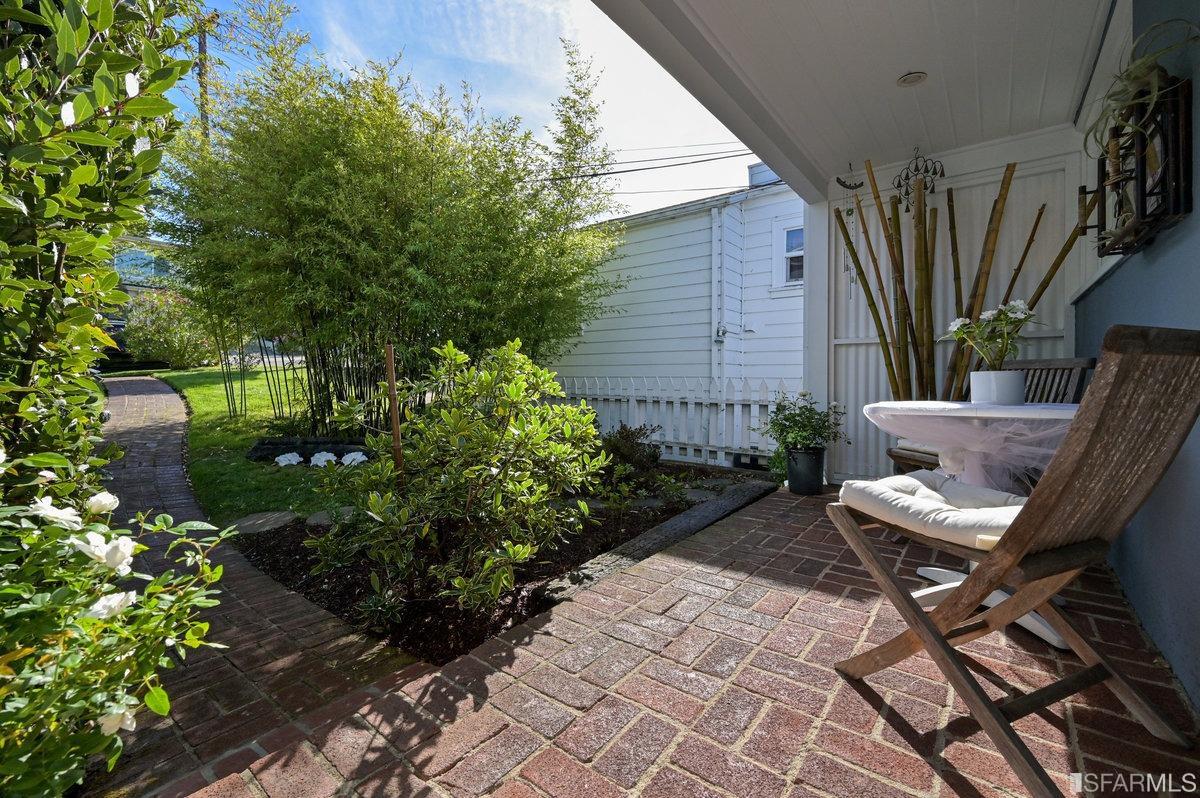 256 Columbia Avenue Kensington, CA 94708 - Photo 34 of 37 a view of a patio with chair and tables back yard of the house