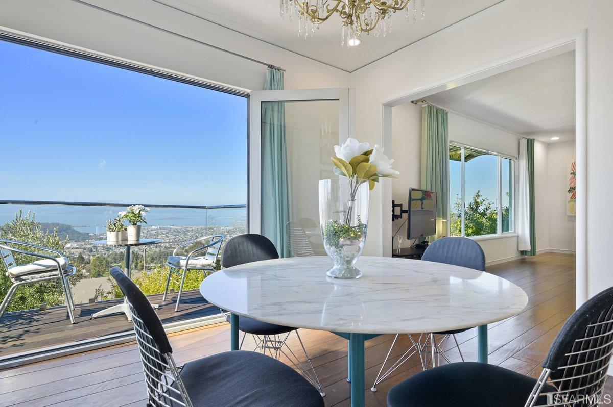 256 Columbia Avenue Kensington, CA 94708 - Photo 6 of 37 a view of a dining room with furniture and wooden floor