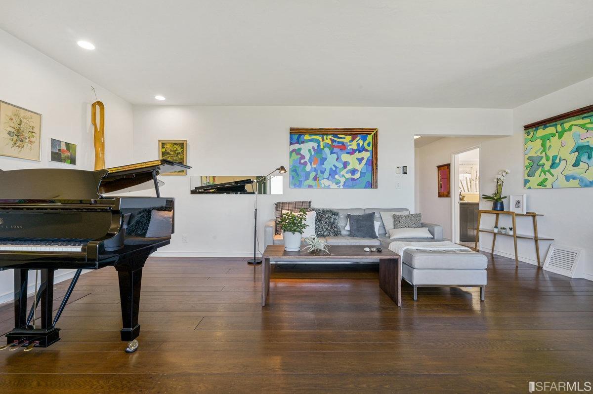 256 Columbia Avenue Kensington, CA 94708 - Photo 9 of 37 a living room with fireplace furniture and a wooden floor