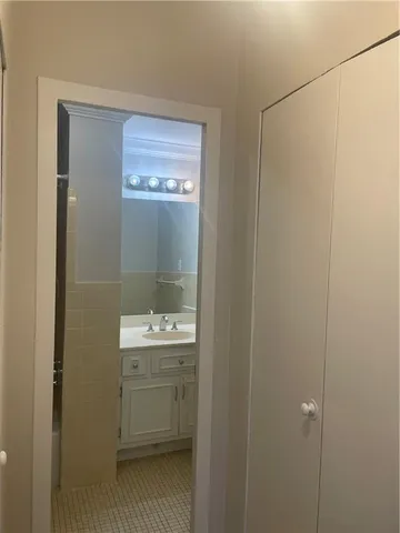 a bathroom with a sink and mirror