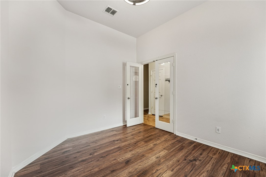5420 Foxhill Road Temple, TX 76502 - Photo 28 of 47 a view of an empty room with wooden floor and closet