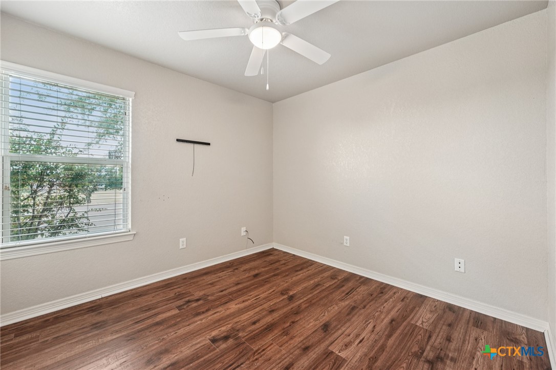 5420 Foxhill Road Temple, TX 76502 - Photo 33 of 47 wooden floor in an empty room with a window