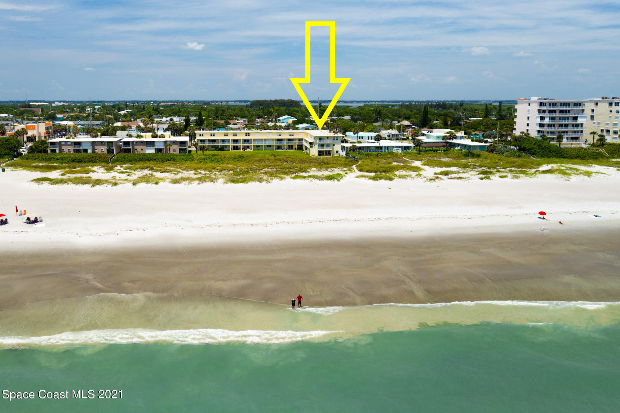 a view of a swimming pool with an ocean view