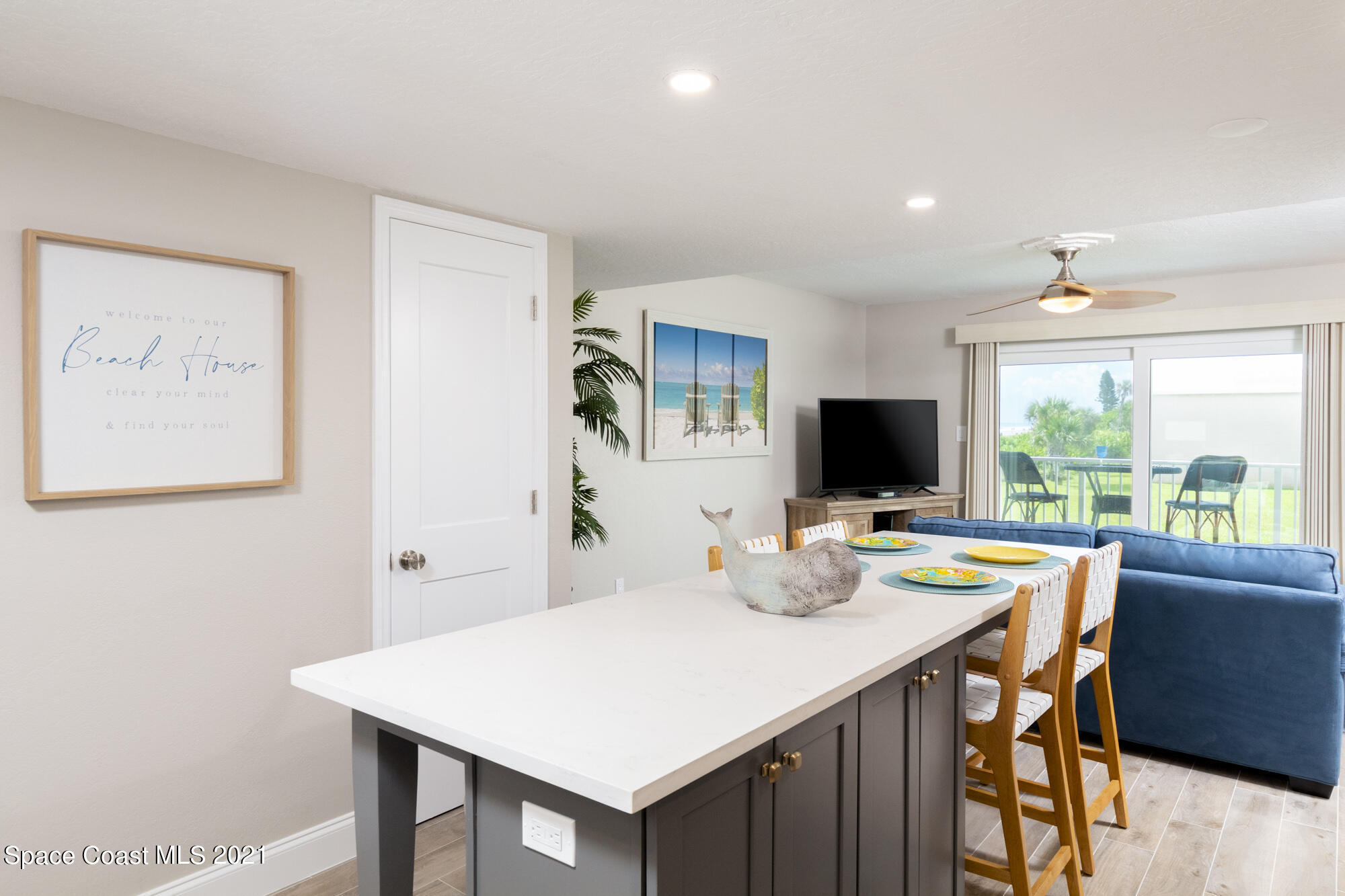 171 North Atlantic Avenue, Unit 39 Cocoa Beach, FL 32931 - Photo 12 of 29 a view of a dining room with a table and chairs