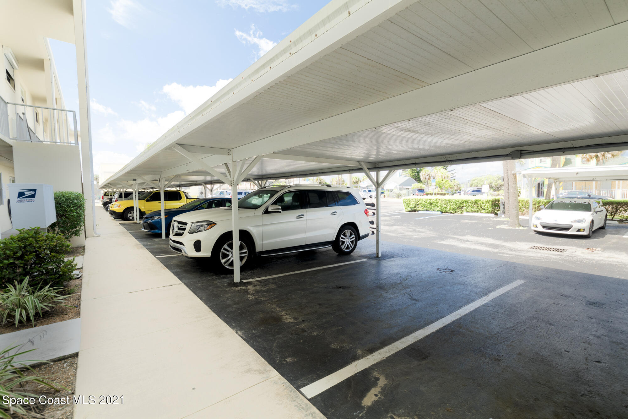 171 North Atlantic Avenue, Unit 39 Cocoa Beach, FL 32931 - Photo 16 of 29 a car parked in parking