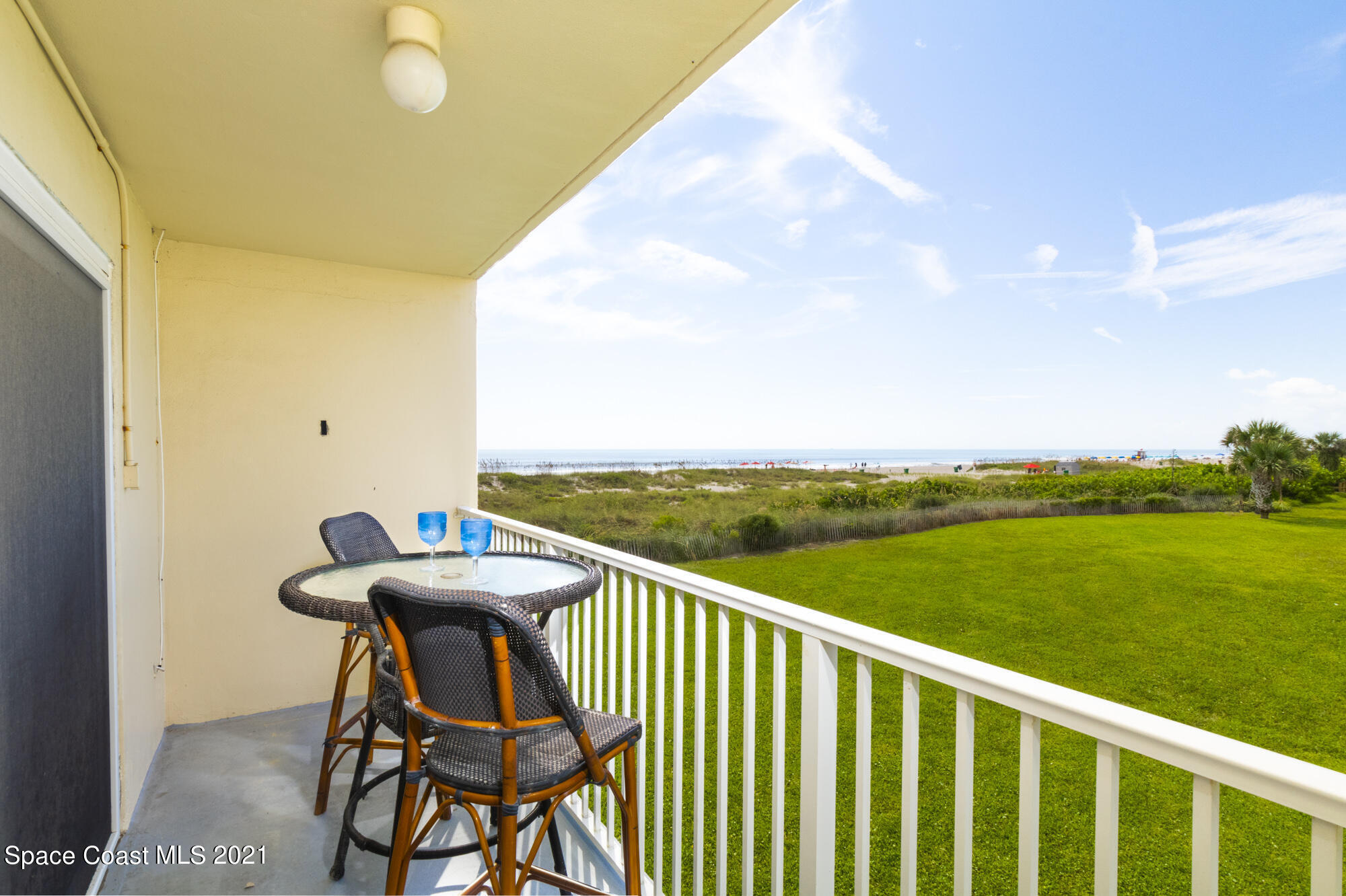 171 North Atlantic Avenue, Unit 39 Cocoa Beach, FL 32931 - Photo 17 of 29 a view of a balcony with furniture