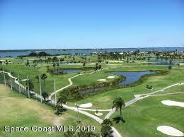 171 North Atlantic Avenue, Unit 39 Cocoa Beach, FL 32931 - Photo 24 of 29 a view of a golf course with a lake