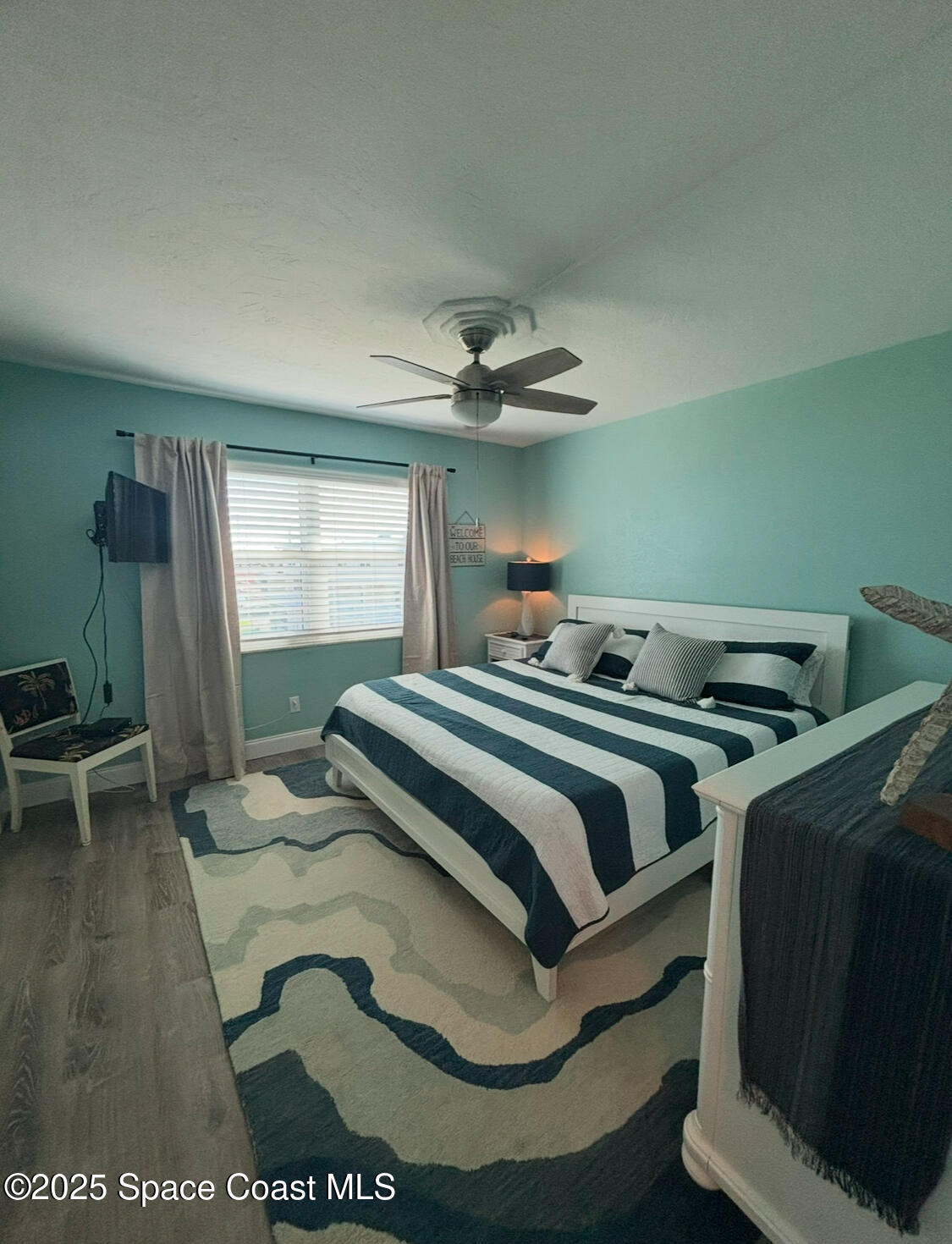 171 North Atlantic Avenue, Unit 39 Cocoa Beach, FL 32931 - Photo 29 of 29 a bedroom with a bed and window