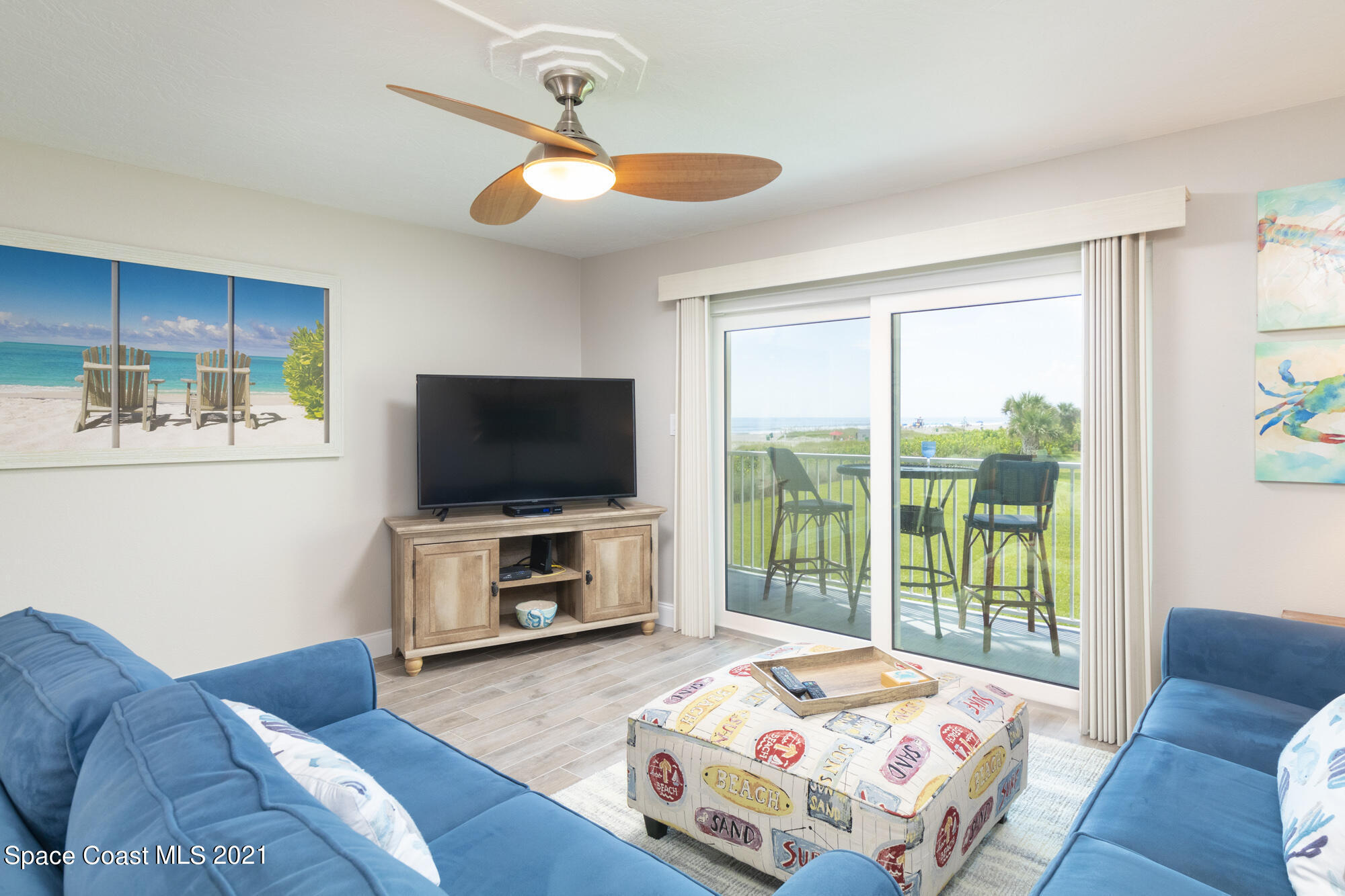 171 North Atlantic Avenue, Unit 39 Cocoa Beach, FL 32931 - Photo 5 of 29 a bedroom with a bed and a television