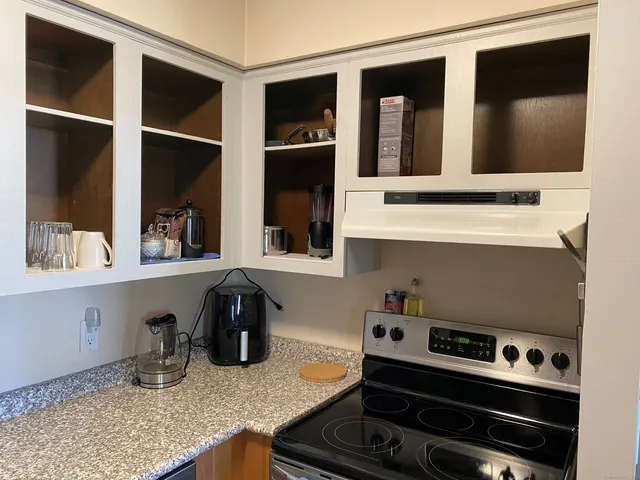 a kitchen with a stove and a microwave
