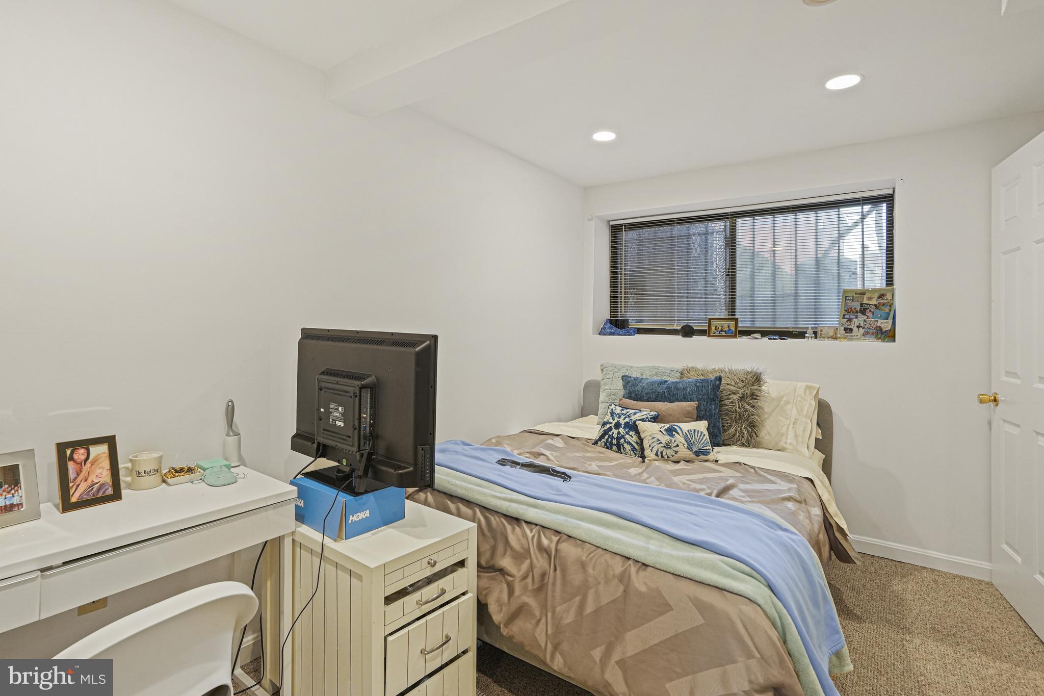 1321 Fairmont Street Northwest, Unit 1 Washington, DC 20009 - Photo 18 of 22 a bedroom with a bed and a tv