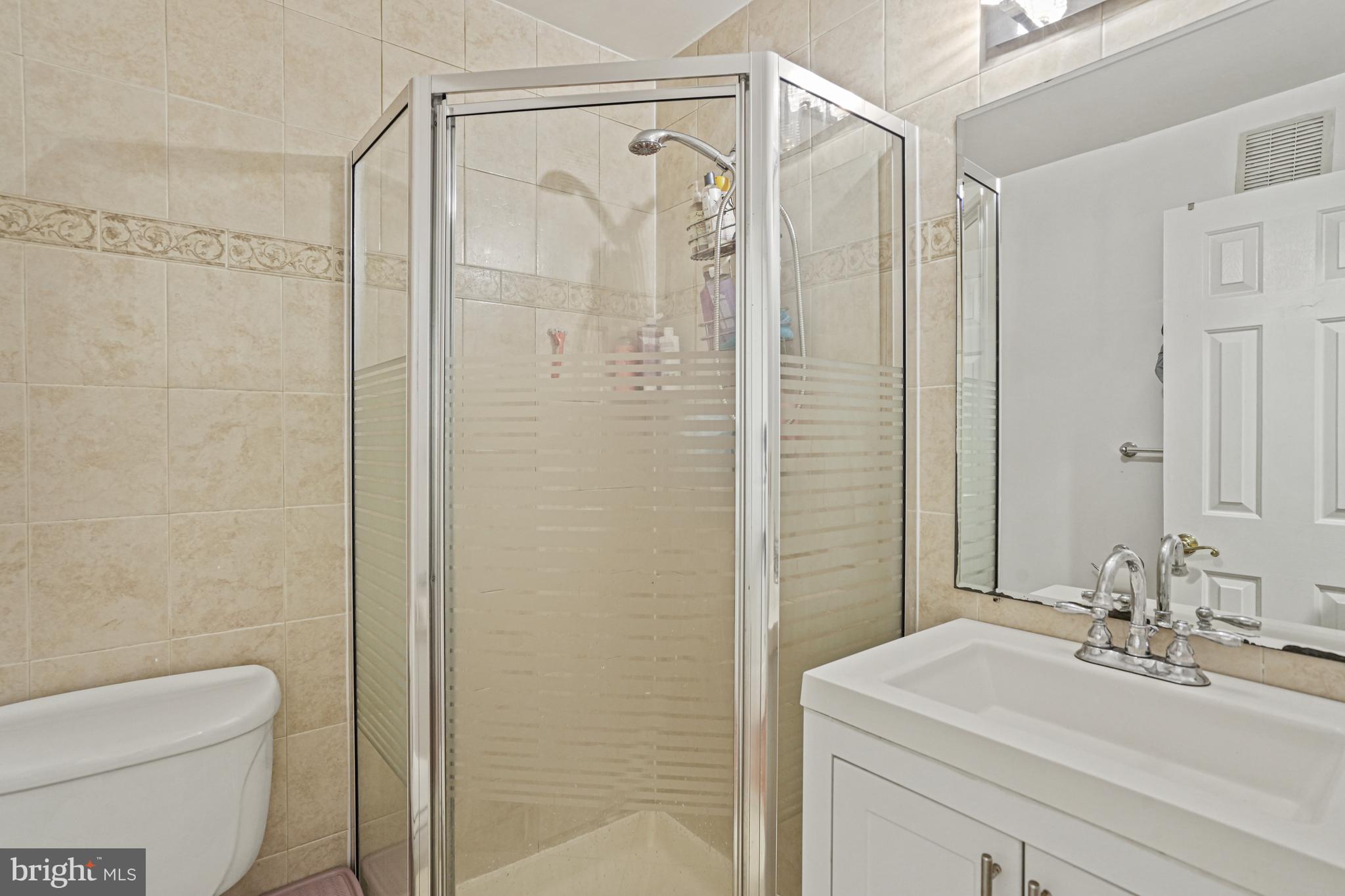 1321 Fairmont Street Northwest, Unit 1 Washington, DC 20009 - Photo 20 of 22 a bathroom with a sink a toilet and shower