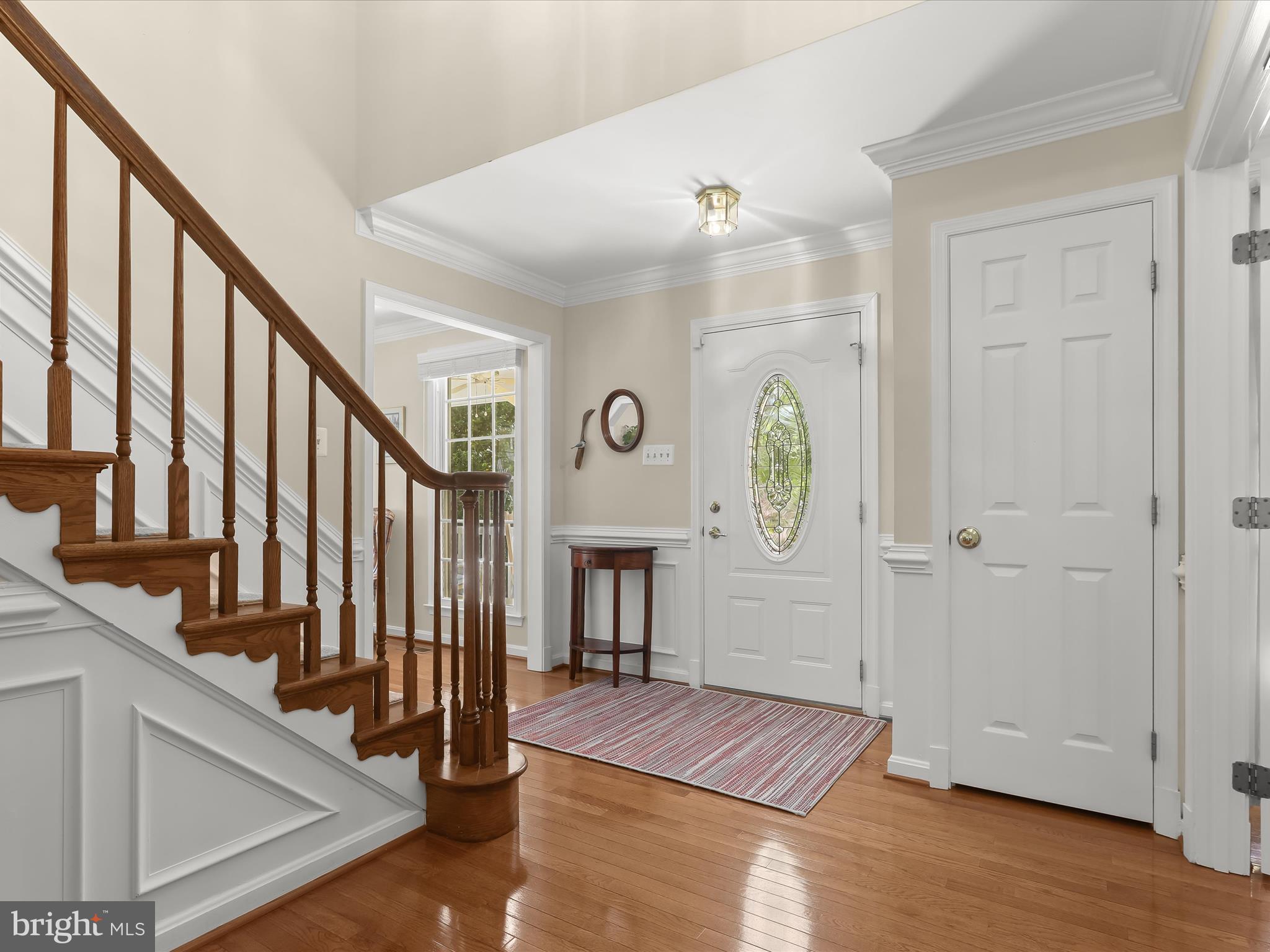 10634 Quarterstaff Road Columbia, MD 21044 - Photo 10 of 62 a view of entryway livingroom and hall with wooden floor