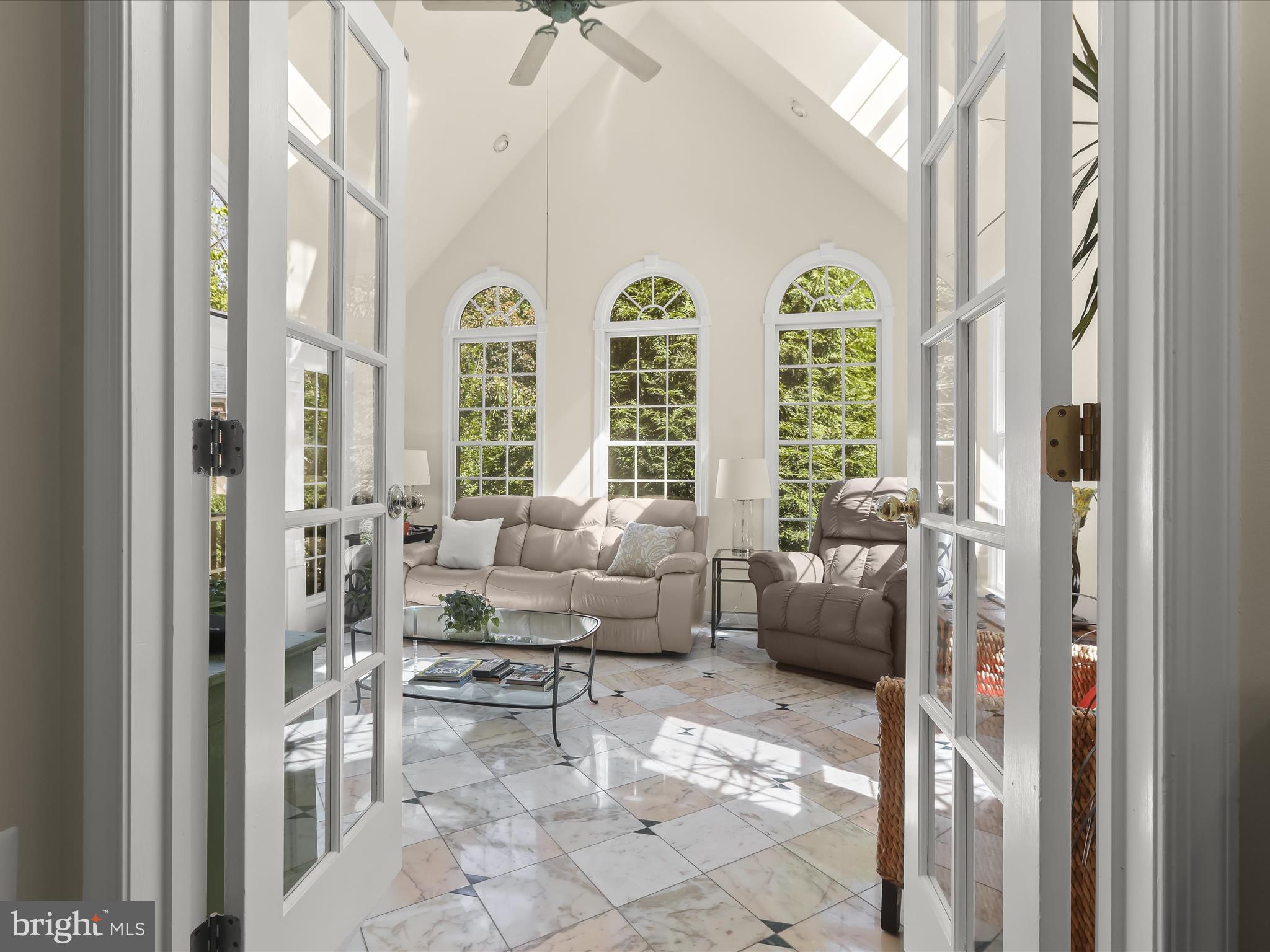 10634 Quarterstaff Road Columbia, MD 21044 - Photo 15 of 62 a living room with furniture and a large window