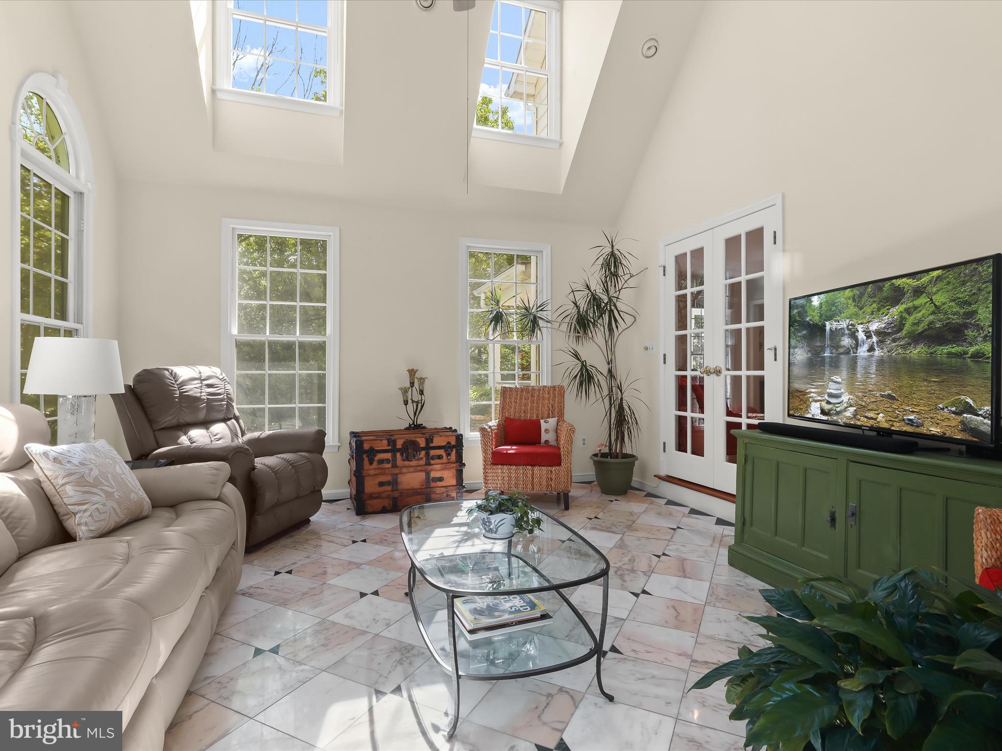 10634 Quarterstaff Road Columbia, MD 21044 - Photo 17 of 62 a living room with furniture potted plant and a large window