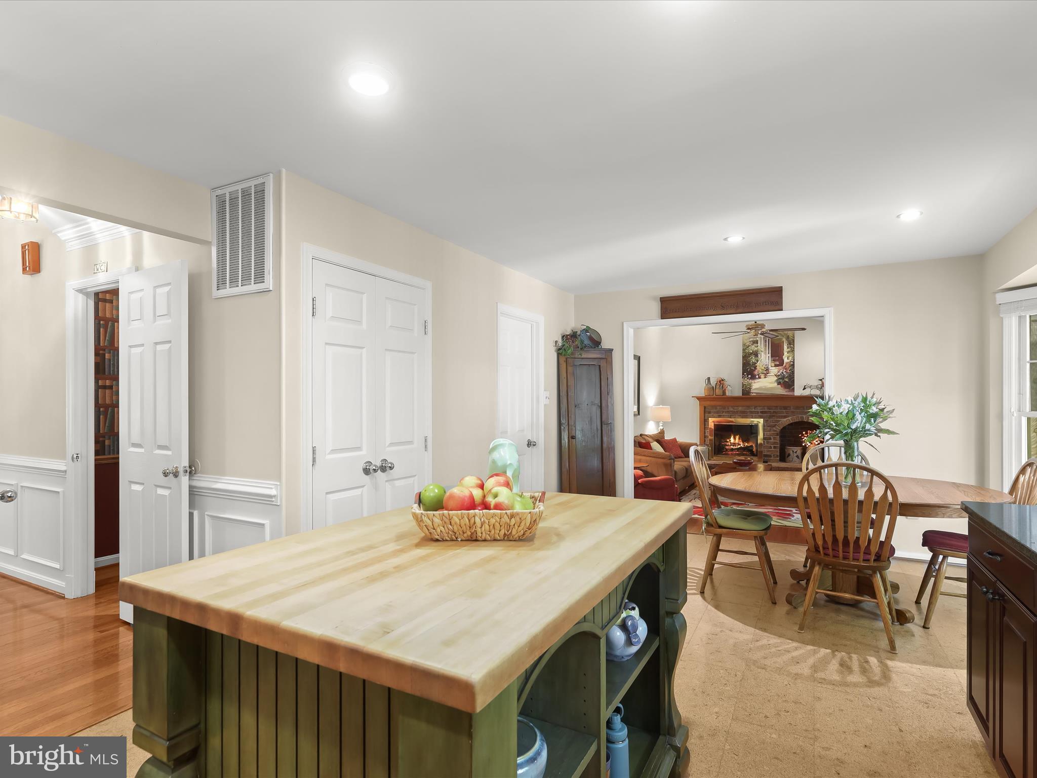 10634 Quarterstaff Road Columbia, MD 21044 - Photo 23 of 62 a view of a dining room with furniture and wooden floor