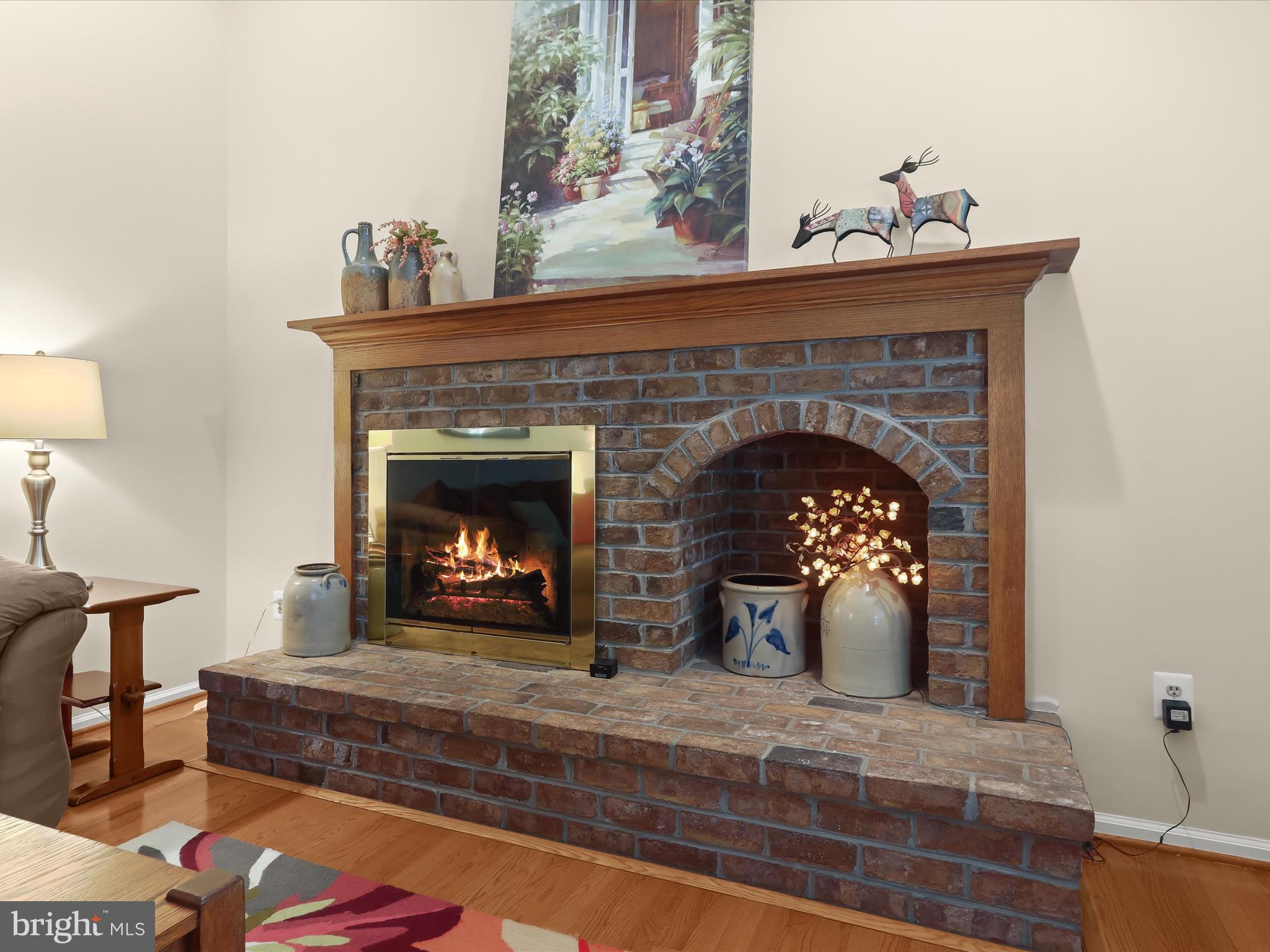 10634 Quarterstaff Road Columbia, MD 21044 - Photo 26 of 62 a living room with furniture and a fireplace