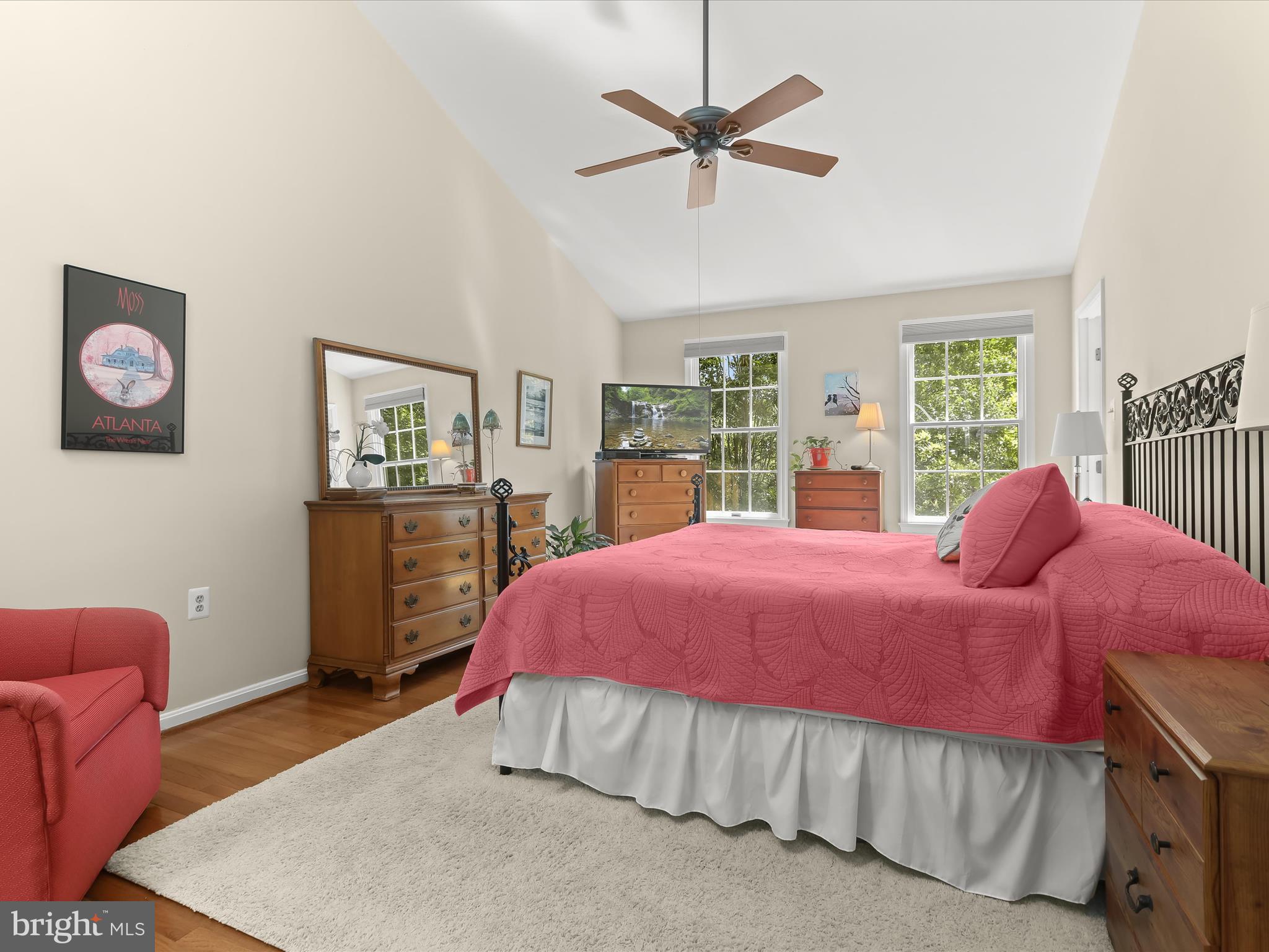 10634 Quarterstaff Road Columbia, MD 21044 - Photo 34 of 62 a bedroom with a bed a chandelier and a dresser