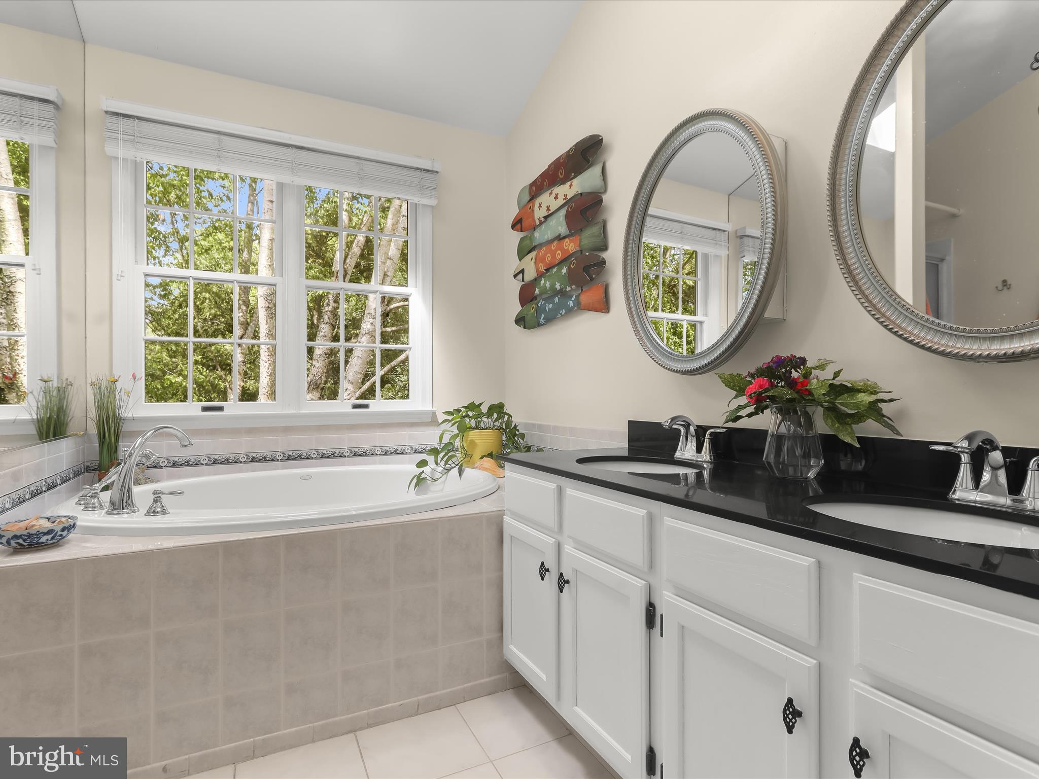 10634 Quarterstaff Road Columbia, MD 21044 - Photo 37 of 62 a bathroom with a sink and a mirror