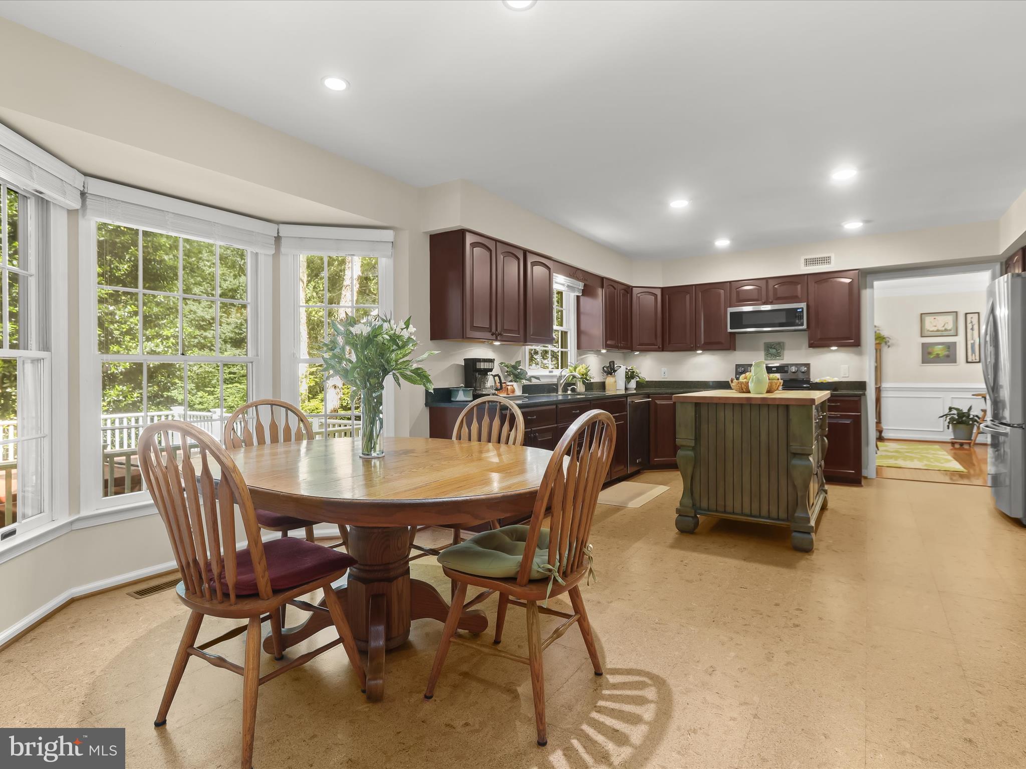 10634 Quarterstaff Road Columbia, MD 21044 - Photo 62 of 62 a dining room with furniture and a kitchen view