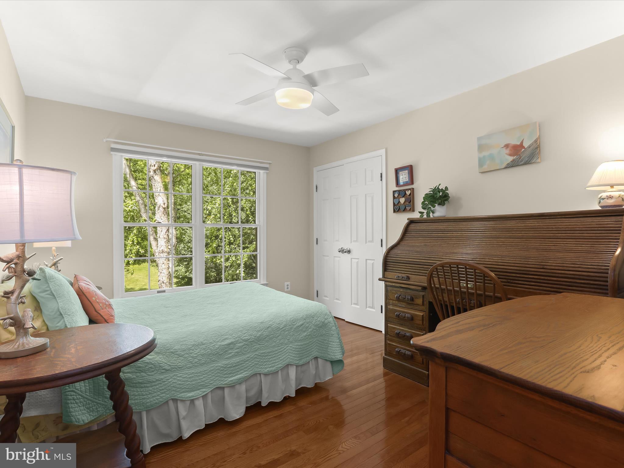 10634 Quarterstaff Road Columbia, MD 21044 - Photo 42 of 62 a bedroom with a bed and a table