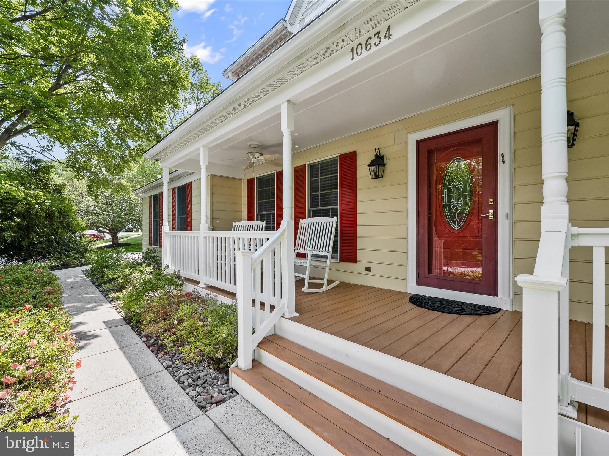 10634 Quarterstaff Road Columbia, MD 21044 - Photo 9 of 62 a front view of a house with garden