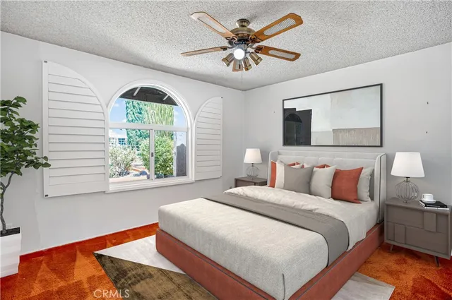 a swimming pool view with a seating space